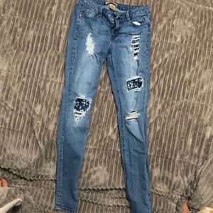 Ripped patched jeans
